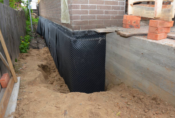 SJ Waterproofing Pros technician performing targeted Exterior Waterproofing assessment in Mill Creek, IN